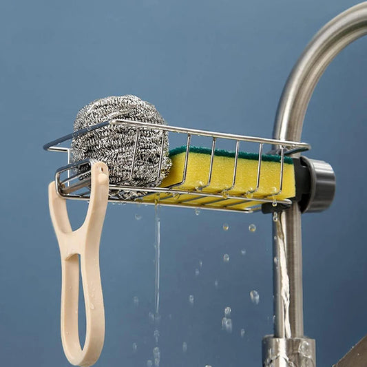Flexible Sink Caddy & Sponge Holder attached to a faucet with yellow sponge and metal scrubber