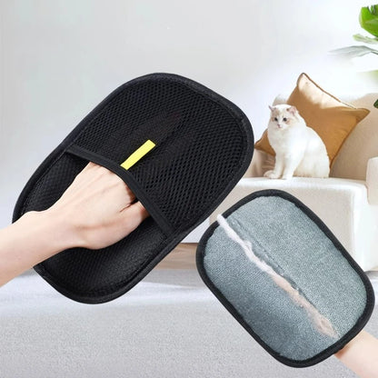 Black mesh Pet Grooming Glove removing hair near a white cat on a chair