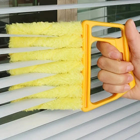 Washable Blinds Duster Brush cleaning between white horizontal blind slats