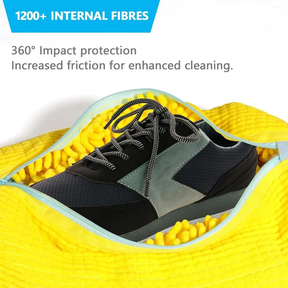 Partially open Shoe Washing Bag for Washing Machine holding a black and gray sneaker in yellow padding