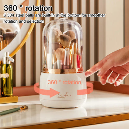 Hand reaching for a white 360° Rotating Makeup Brush Storage Box with rose gold band and life logo