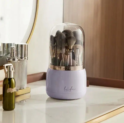 Light purple 360° Rotating Makeup Brush Storage Box with gold rim and black-handled brushes