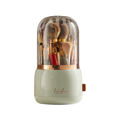 Light green 360° Rotating Makeup Brush Storage Box with gold band, clear dome and side switch