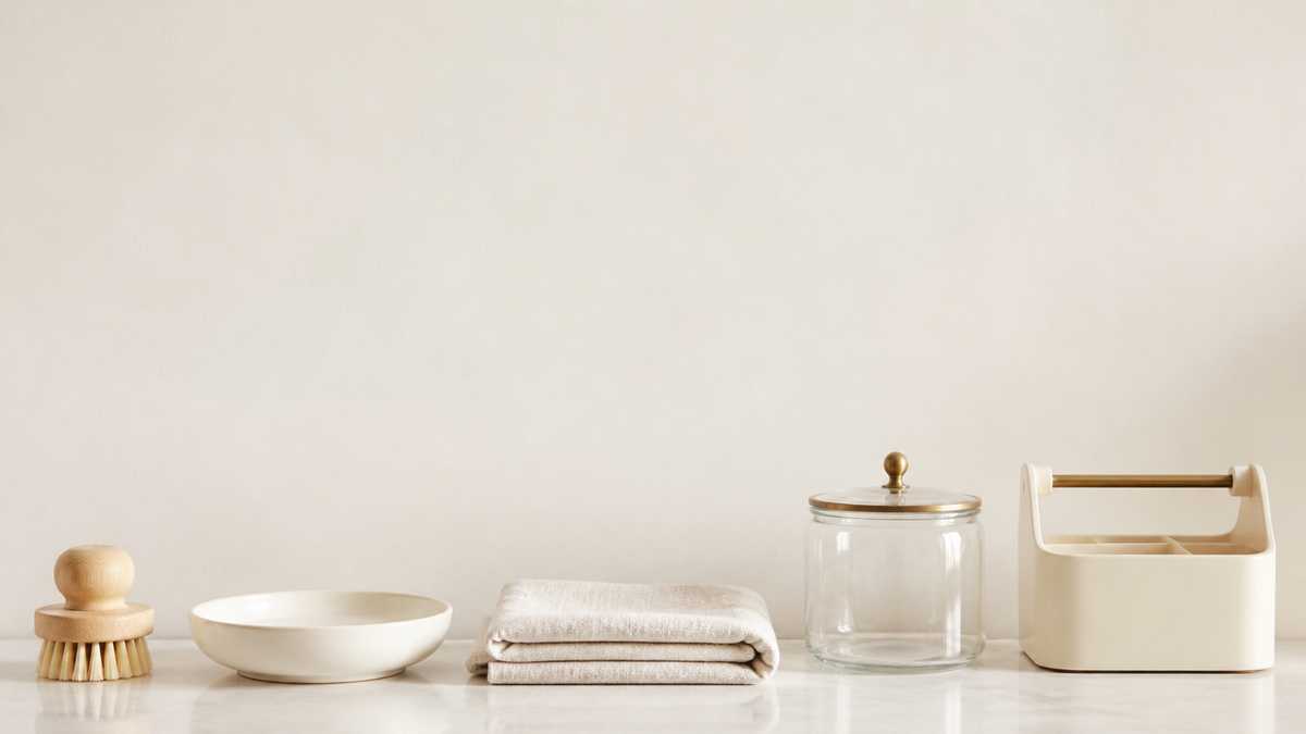 Under fifteen dollars category banner - small household tools and organizers along a bright counter, calm wall above (AI-generated visualization)